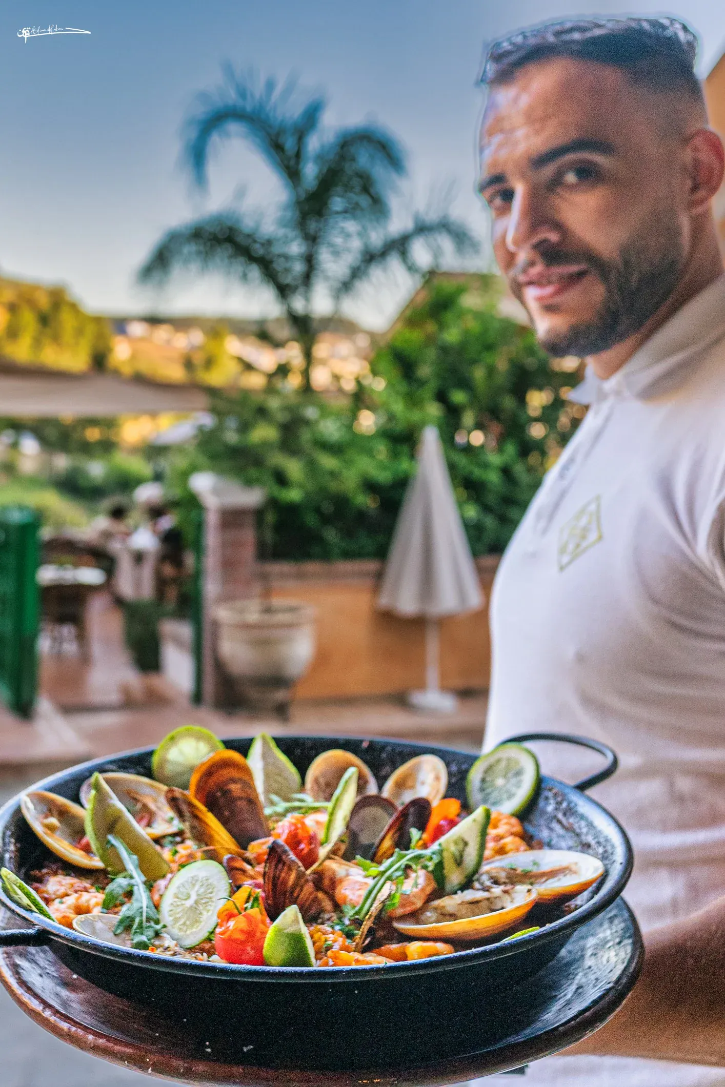 Bartender preparing a signature cocktail at Triana rooftop bar in Chefchaouen