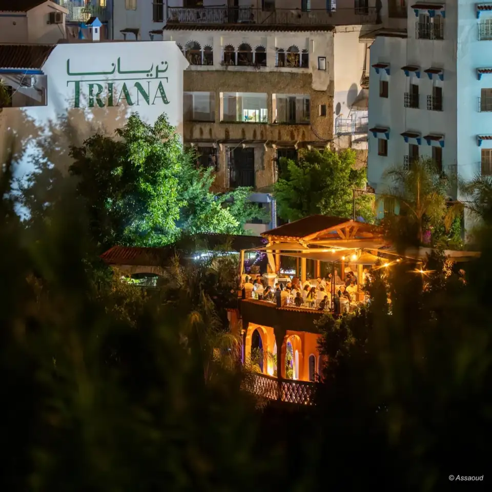 Triana glowing above Chefchaouen at night