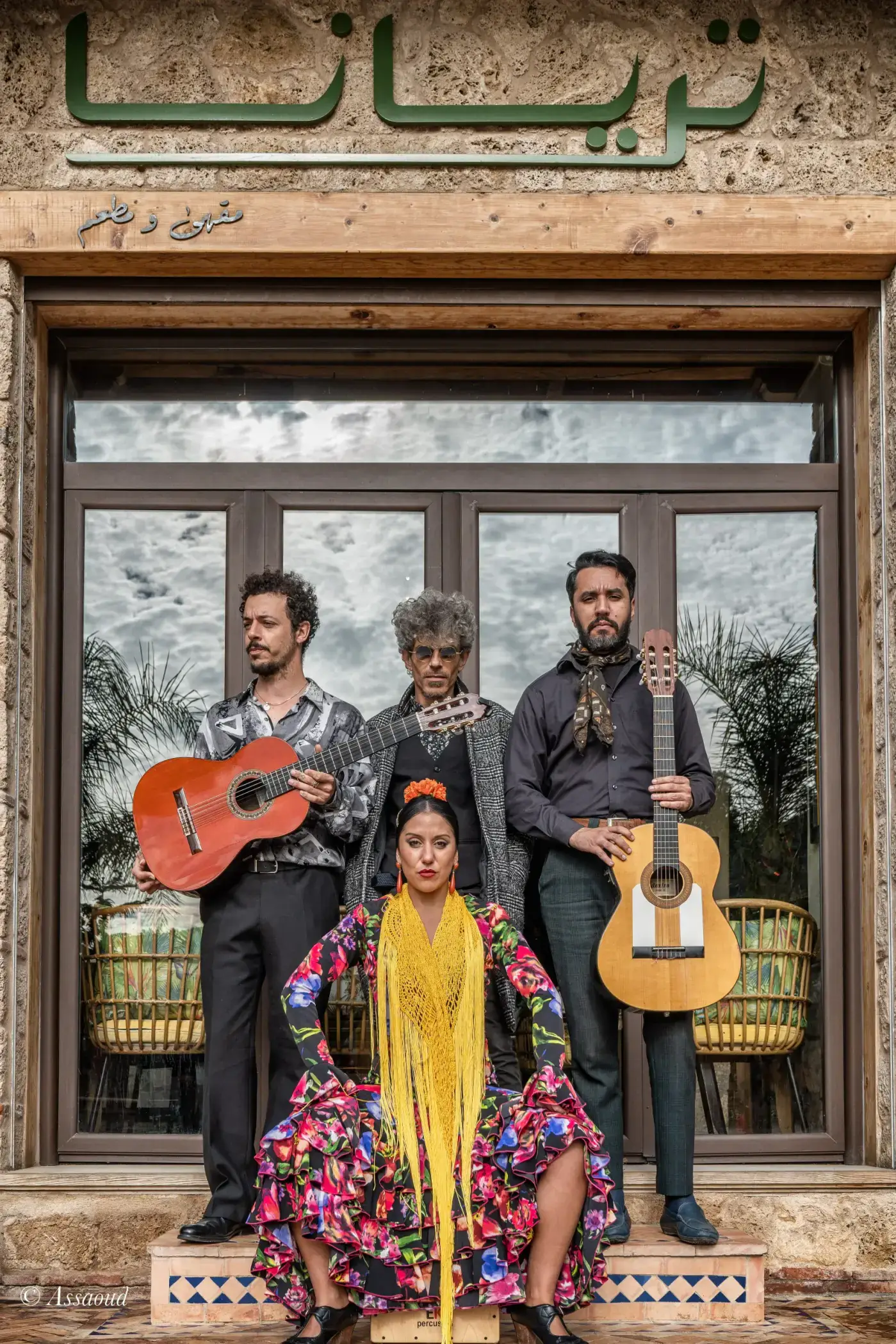 Flamenco musicians and dancer posing in front of Triana restaurant in Chefchaouen